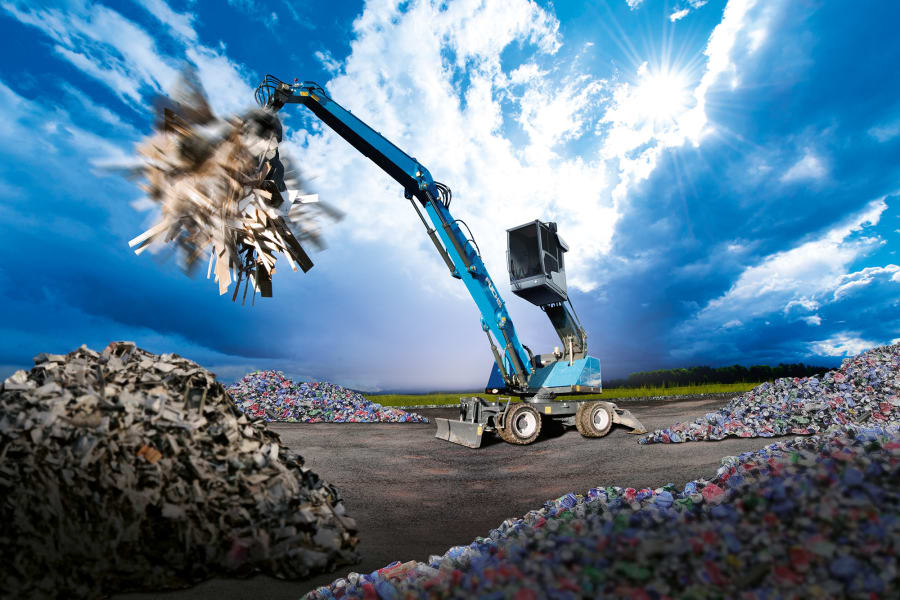 Fuchs material handler moving recycled waste