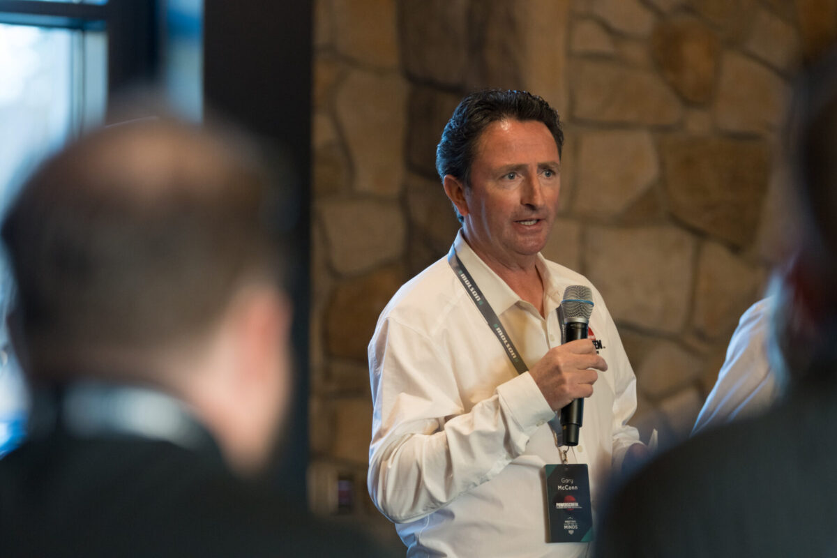 man presenting with a microphone