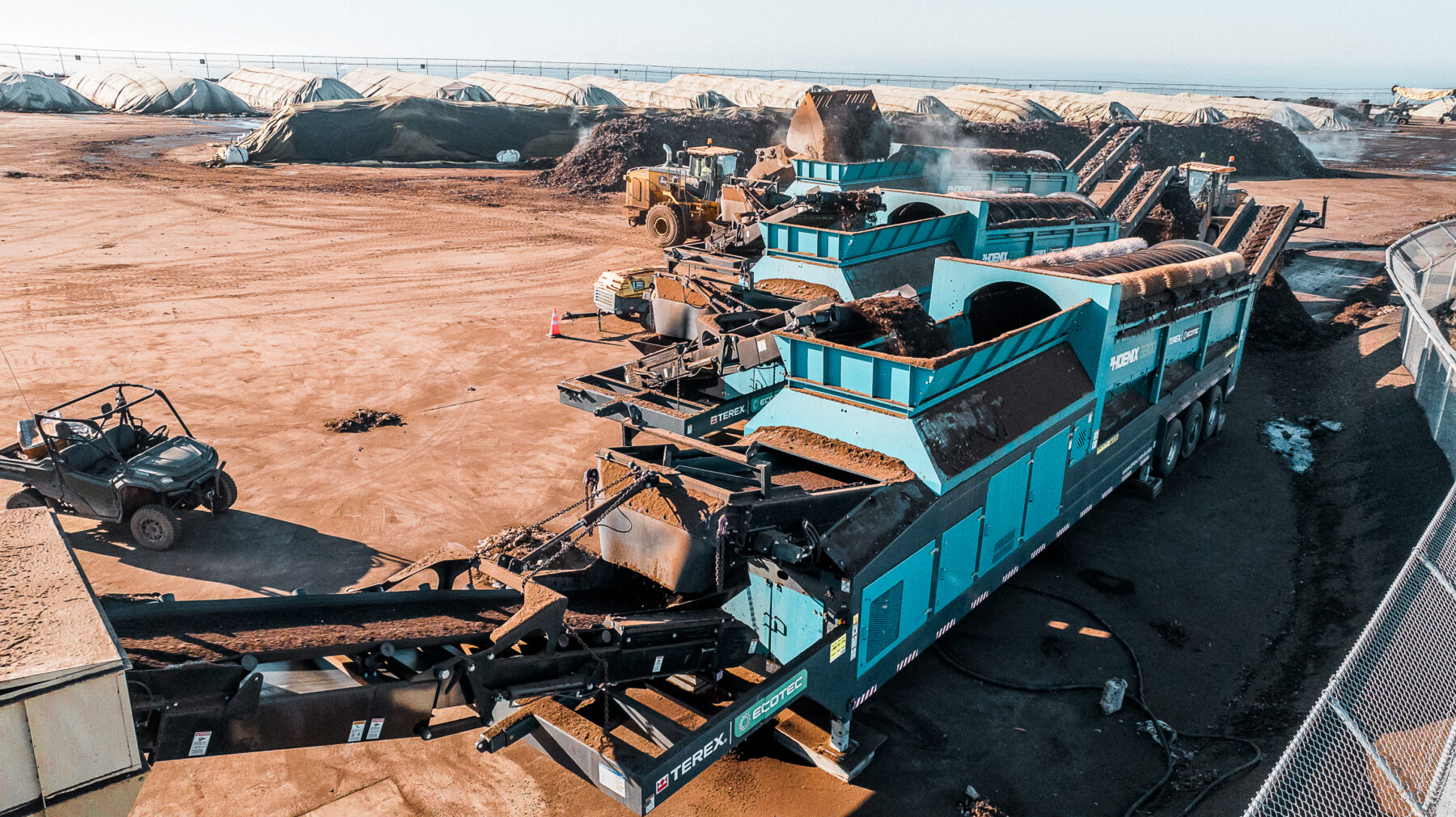Three Terex Ecotec Phoenix 3300 Trommel Screener working in unison.