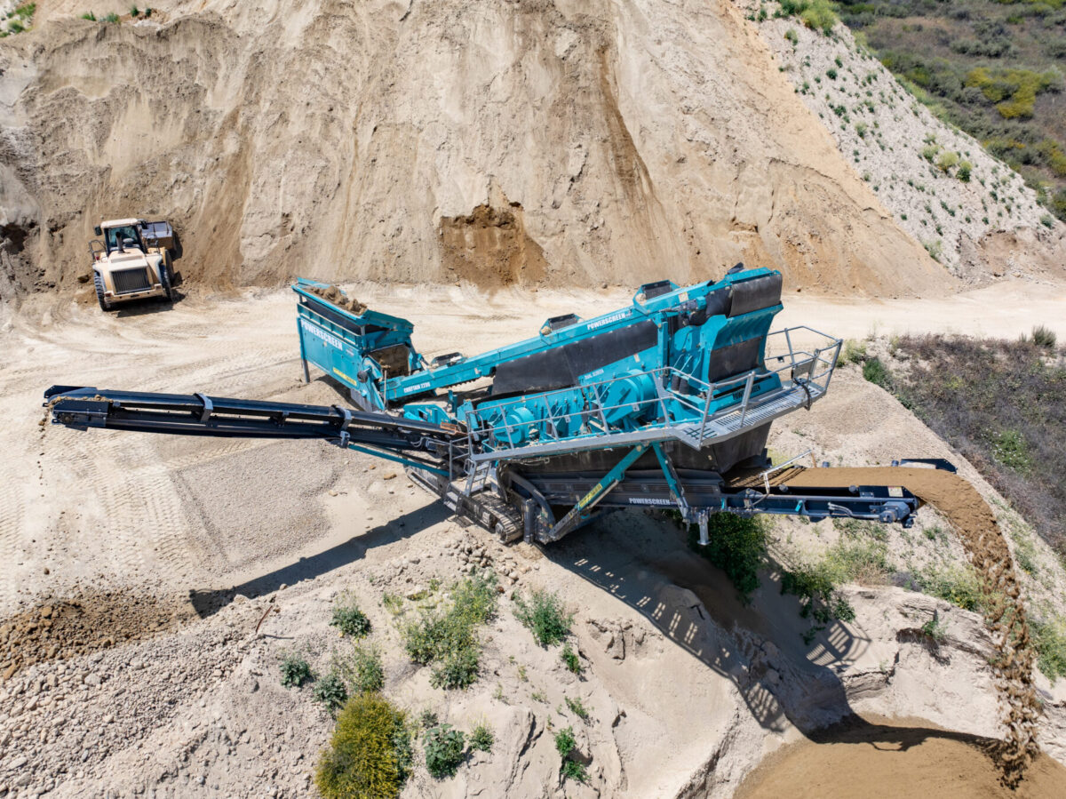 Blue screening machine on edge of cliff.