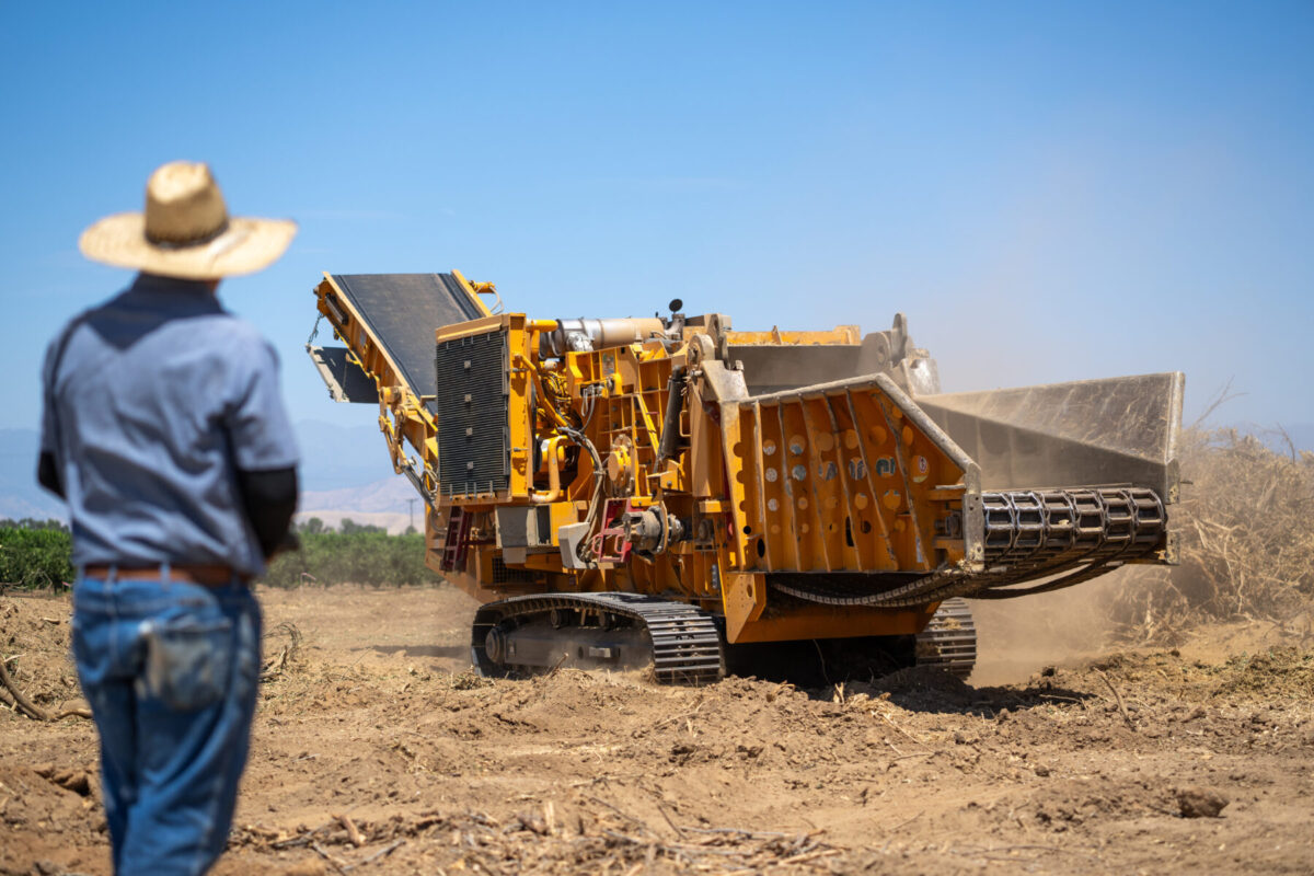 Man moving a CBI 6800CT Grinder