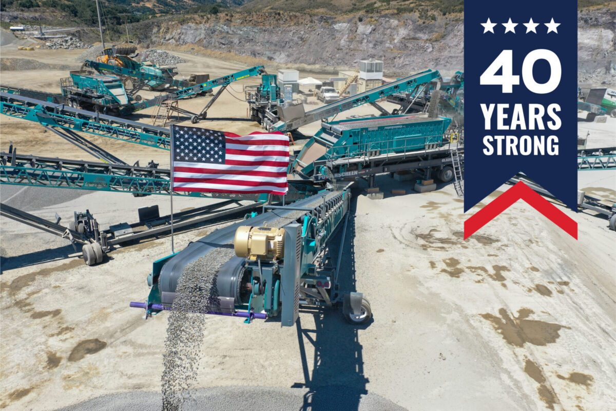 Powerscreen crushing and screening spread with American flag flying with 40 years strong icon
